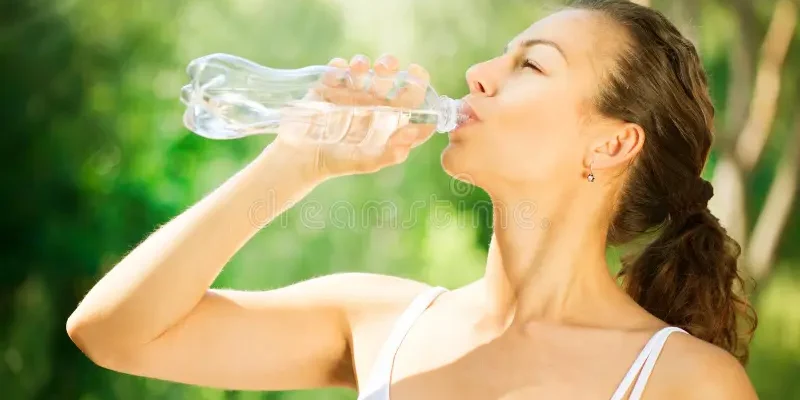 Woman Drinking Water In Sun – Stay Hydrated While Tanning Outdoors
